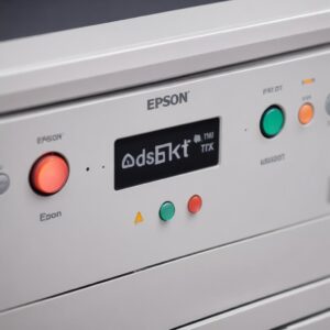 Close-up of an Epson printer's control panel with two indicator lights blinking alternately (one for ink, one for paper), showing frustration but also a