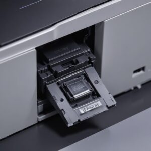 A close-up shot of a small, shiny optical sensor on the carriage unit of an Epson L3210 printer, highlighted for clarity against the printer's interior.